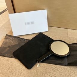 thumbnail for The export counter is full of gifts, hand-held makeup mirrors, patent leather rhombic make-up mirrors, gift boxes
